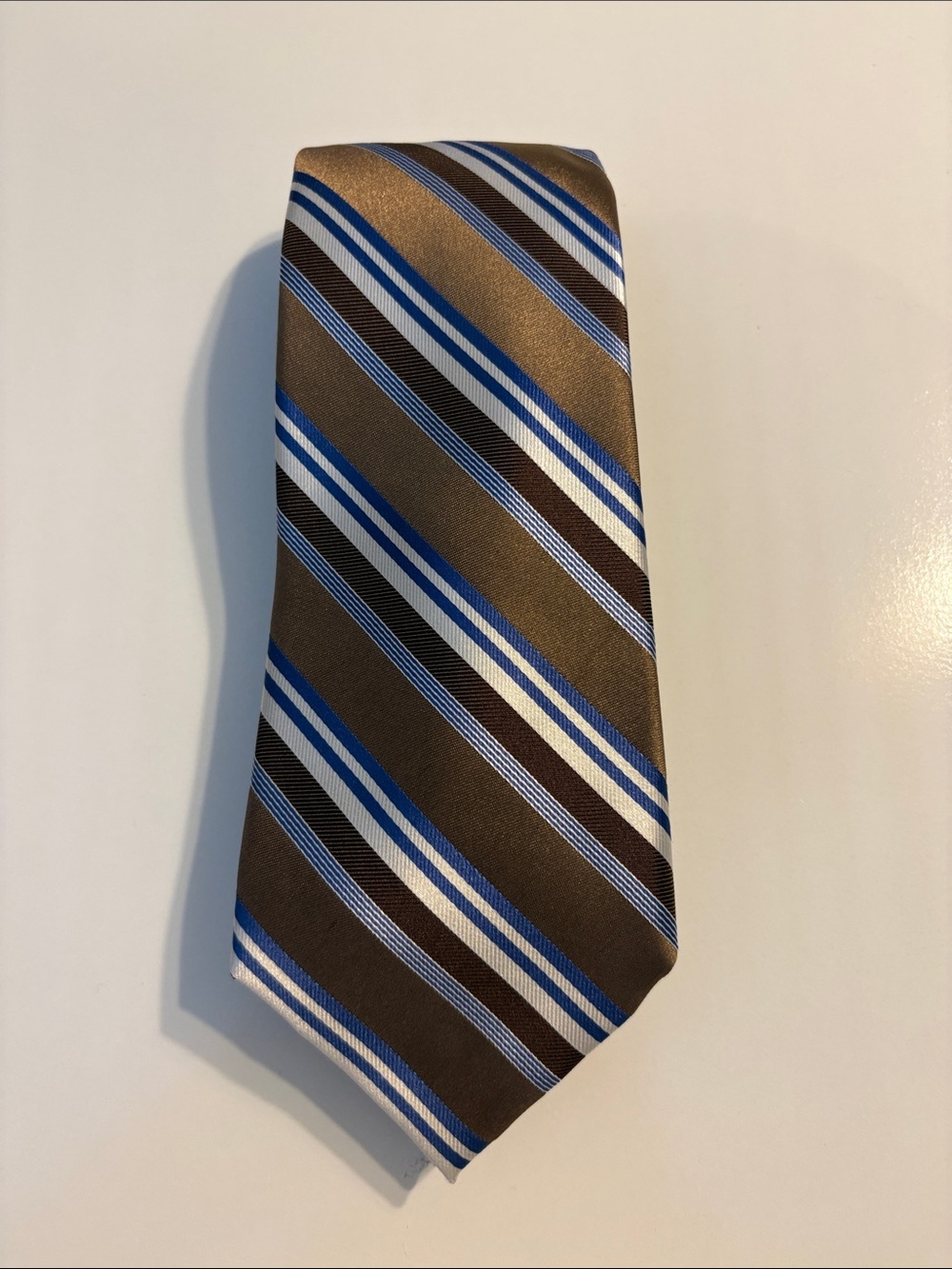 Brown, blue and white tie. 50% silk, 50 polyester.